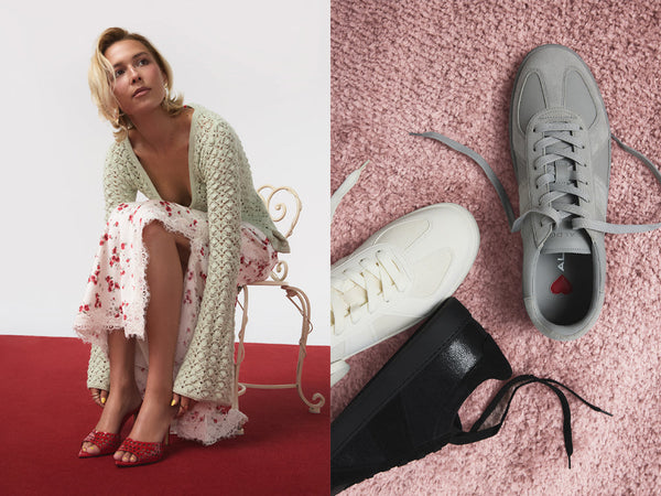Woman in a floral dress and red sandals on a red carpet, with close-up of white, grey and black sneakers black on a pink carpet.